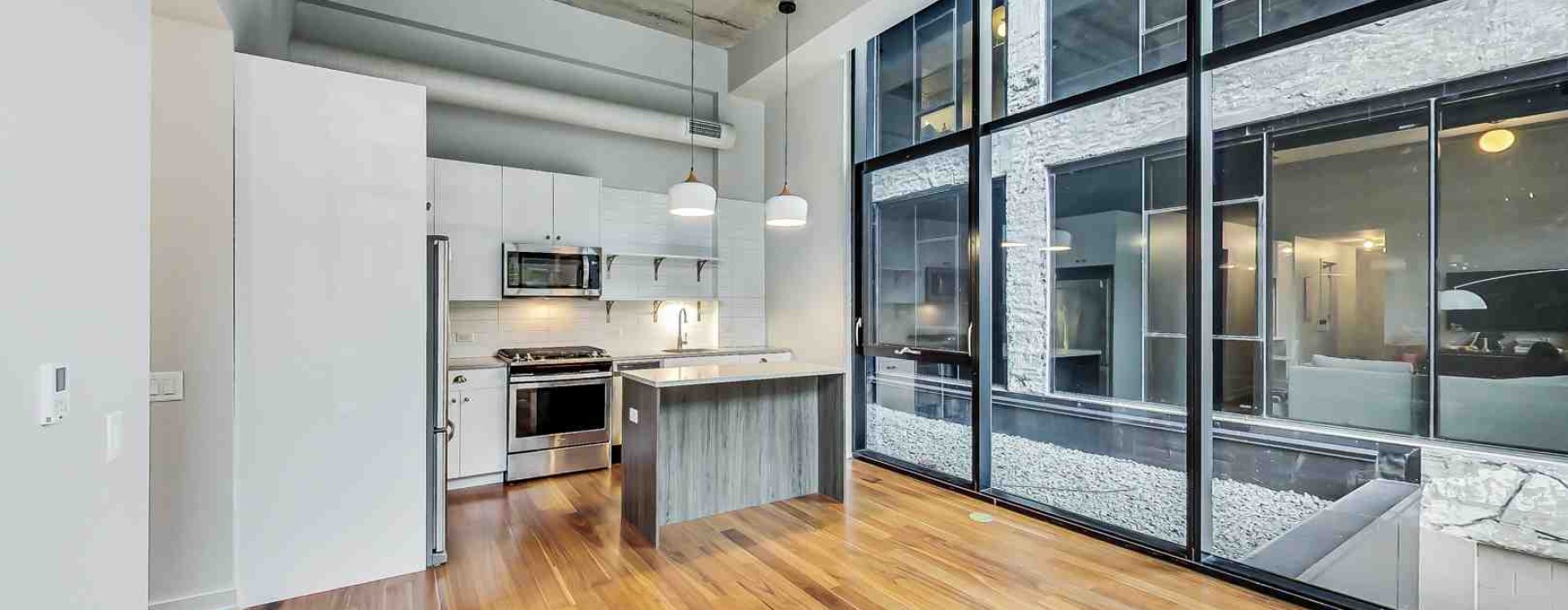 Industrial apartments Chicago loft interior with exposed brick and high ceilings - Industrial apartments Chicago
