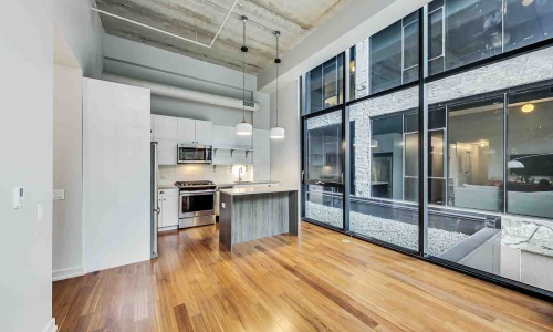 Industrial apartments Chicago loft interior with exposed brick and high ceilings - Industrial apartments Chicago