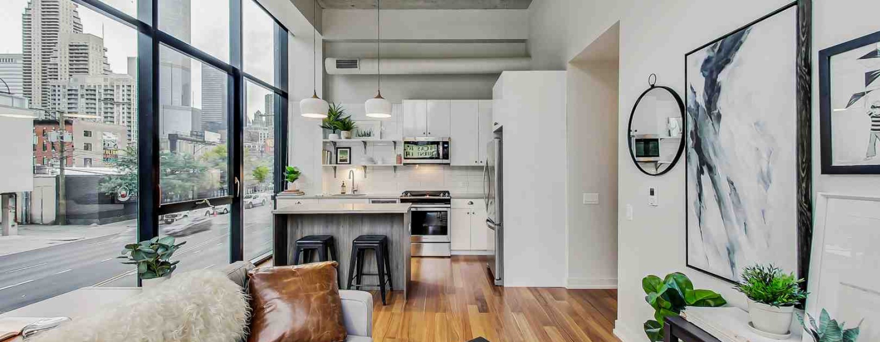 Modern apartment features interior with floor-to-ceiling windows - Modern apartment features