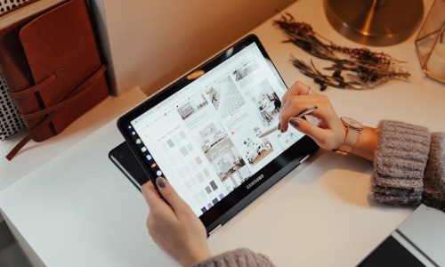 a person happily taking a virtual tour of a luxury apartment on a tablet. - apartments for rent virtual tour