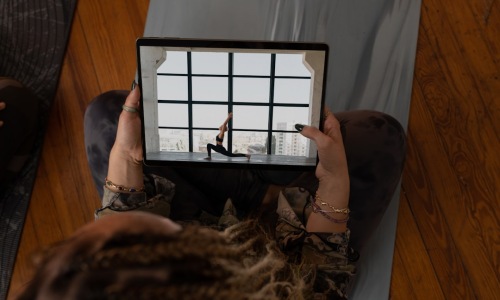 person using tablet to view virtual apartment tour - Virtual Apartment Tours